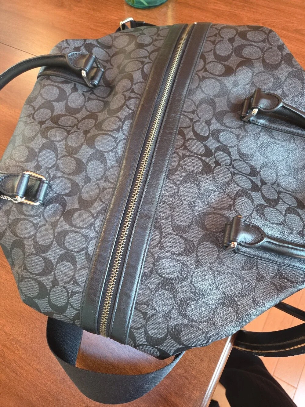 Coach Black Signature Leather Weekender tote bag dark gray and black.